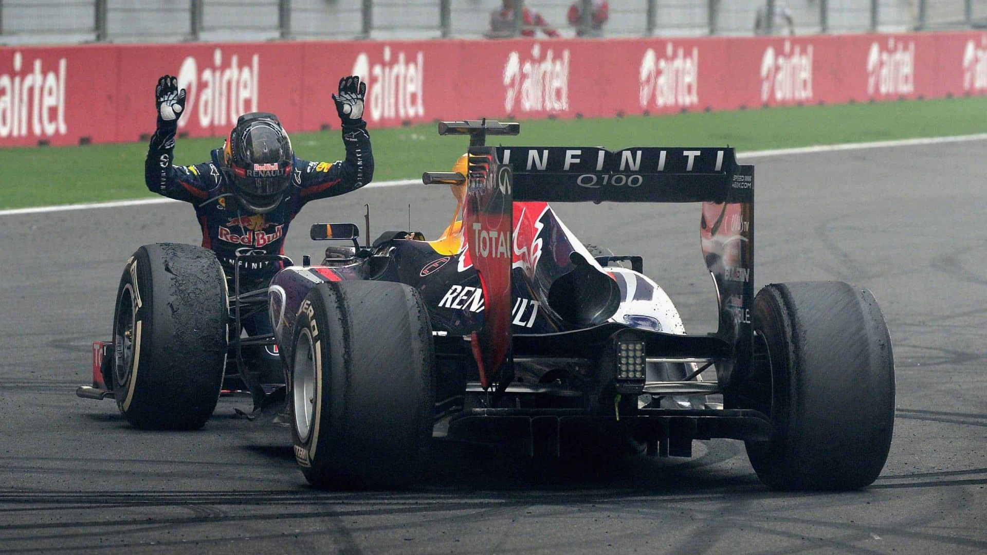 NOIDA, INDIA - OCTOBER 27:  Race winner and 2013 Formula One World Champion Sebastian Vettel of Germany and Infiniti Red Bull Racing celebrates in front of the crowd on the main straight following the Indian Formula One Grand Prix at Buddh International Circuit on October 27, 2013 in Noida, India.  (Photo by Getty Images/Getty Images) *** Local Caption *** Sebastian Vettel // Getty Images / Red Bull Content Pool  // SI201412181287 // Usage for editorial use only //