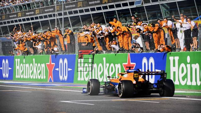 Daniel Ricciardo, McLaren MCL35M, 1st position, takes victory to the delight of his team on the pit wall (image courtesy McLaren)