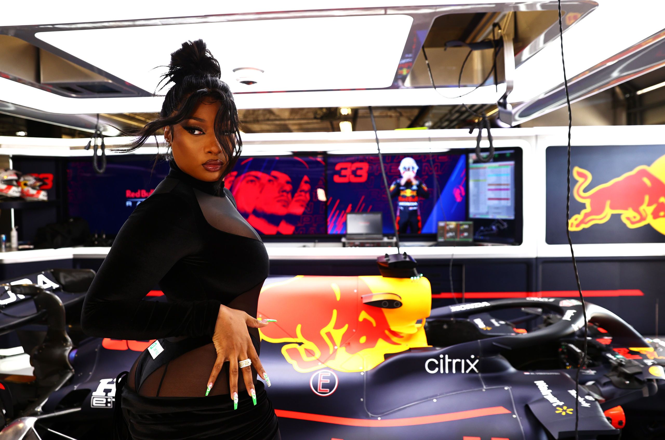 AUSTIN, TEXAS - OCTOBER 24: Megan Thee Stallion poses for a photo in the Red Bull Racing garage before the F1 Grand Prix of USA at Circuit of The Americas on October 24, 2021 in Austin, Texas. (Photo by Mark Thompson/Getty Images) // Getty Images / Red Bull Content Pool // SI202110240625 // Usage for editorial use only //