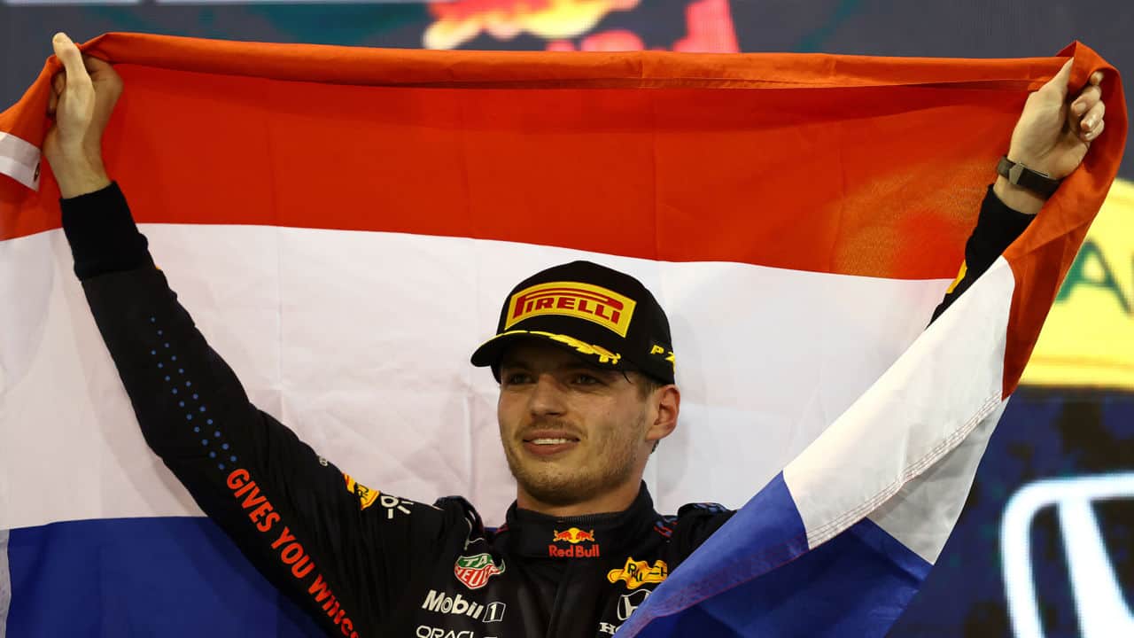 ABU DHABI, UNITED ARAB EMIRATES - DECEMBER 12: Race winner and 2021 F1 World Drivers Champion Max Verstappen of Netherlands and Red Bull Racing celebrates on the podium during the F1 Grand Prix of Abu Dhabi at Yas Marina Circuit on December 12, 2021 in Abu Dhabi, United Arab Emirates. (Photo by Bryn Lennon/Getty Images) // Getty Images / Red Bull Content Pool // SI202112120595 // Usage for editorial use only //