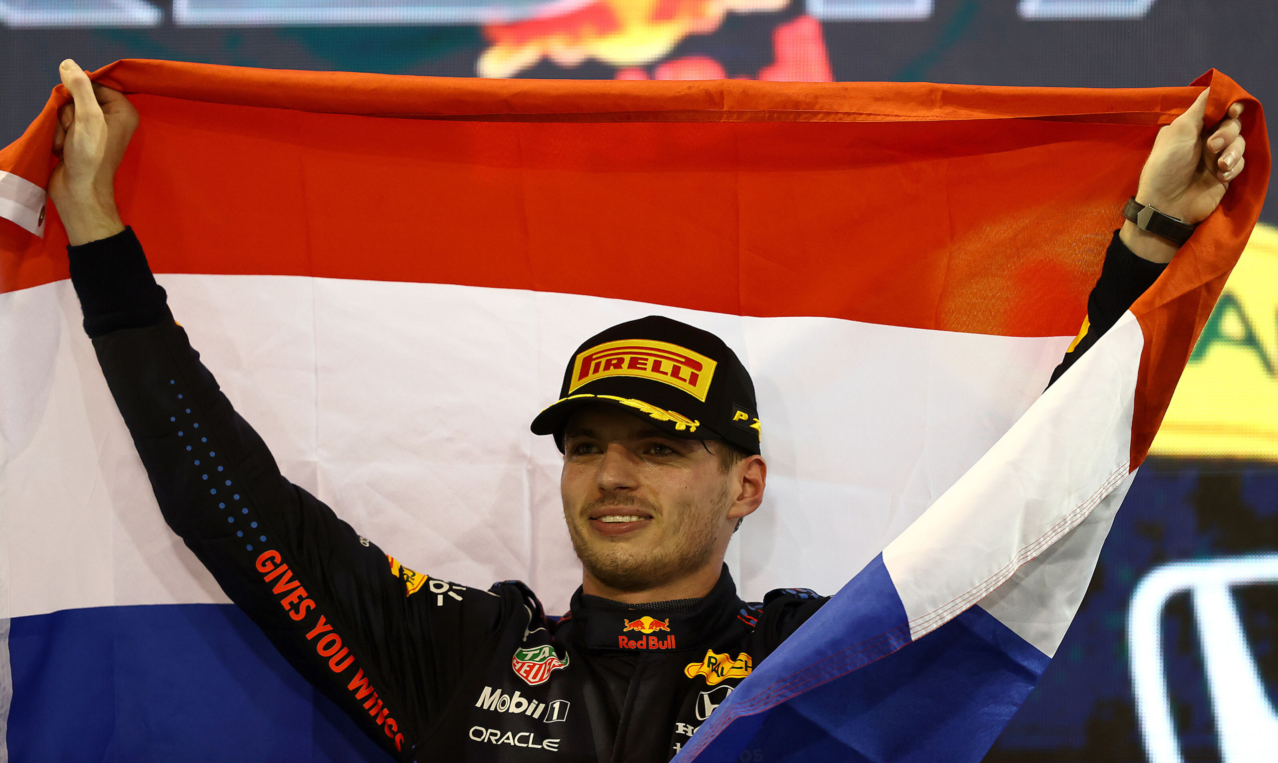 ABU DHABI, UNITED ARAB EMIRATES - DECEMBER 12: Race winner and 2021 F1 World Drivers Champion Max Verstappen of Netherlands and Red Bull Racing celebrates on the podium during the F1 Grand Prix of Abu Dhabi at Yas Marina Circuit on December 12, 2021 in Abu Dhabi, United Arab Emirates. (Photo by Bryn Lennon/Getty Images) // Getty Images / Red Bull Content Pool // SI202112120595 // Usage for editorial use only //
