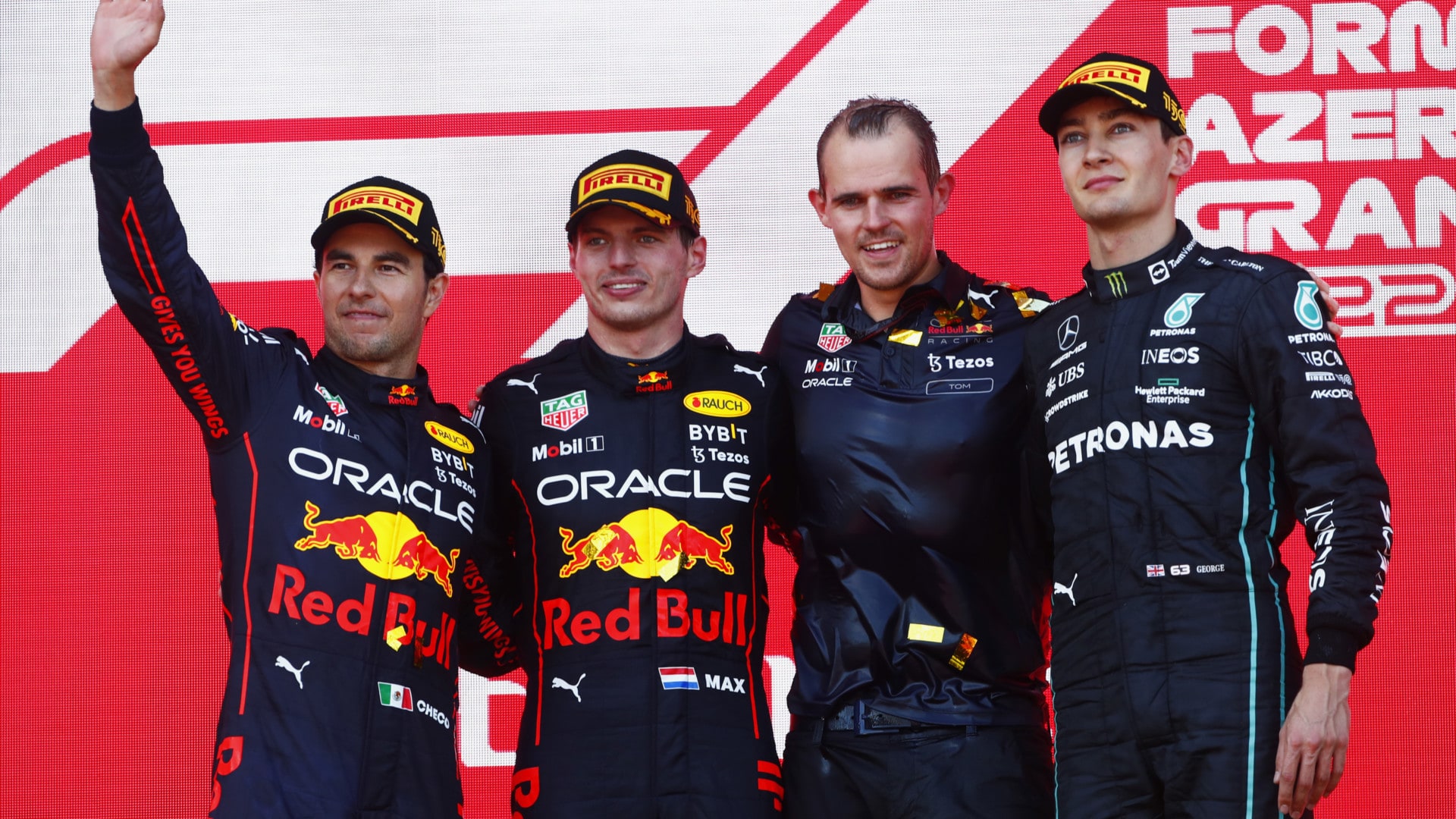 2022 Azerbaijan Grand Prix Tyre Performance Analysis - BAKU CITY CIRCUIT, AZERBAIJAN - JUNE 12: Sergio Perez, Red Bull Racing, 2nd position, Max Verstappen, Red Bull Racing, 1st position, the Red Bull trophy delegate and George Russell, Mercedes-AMG, 3rd position, on the podium during the Azerbaijan GP at Baku City Circuit on Sunday June 12, 2022 in Baku, Azerbaijan. (Photo by Sam Bloxham / LAT Images)