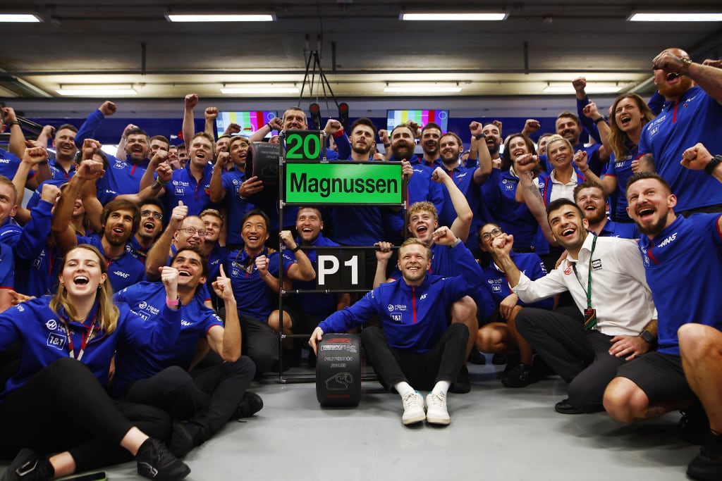 AUTóDROMO JOSé CARLOS PACE, BRAZIL - NOVEMBER 11: Kevin Magnussen, Haas F1 Team, and the Haas F1 team celebrate after securing pole during the São Paulo GP at Autódromo José Carlos Pace on Friday November 11, 2022 in Sao Paulo, Brazil. (Photo by Sam Bloxham / LAT Images)