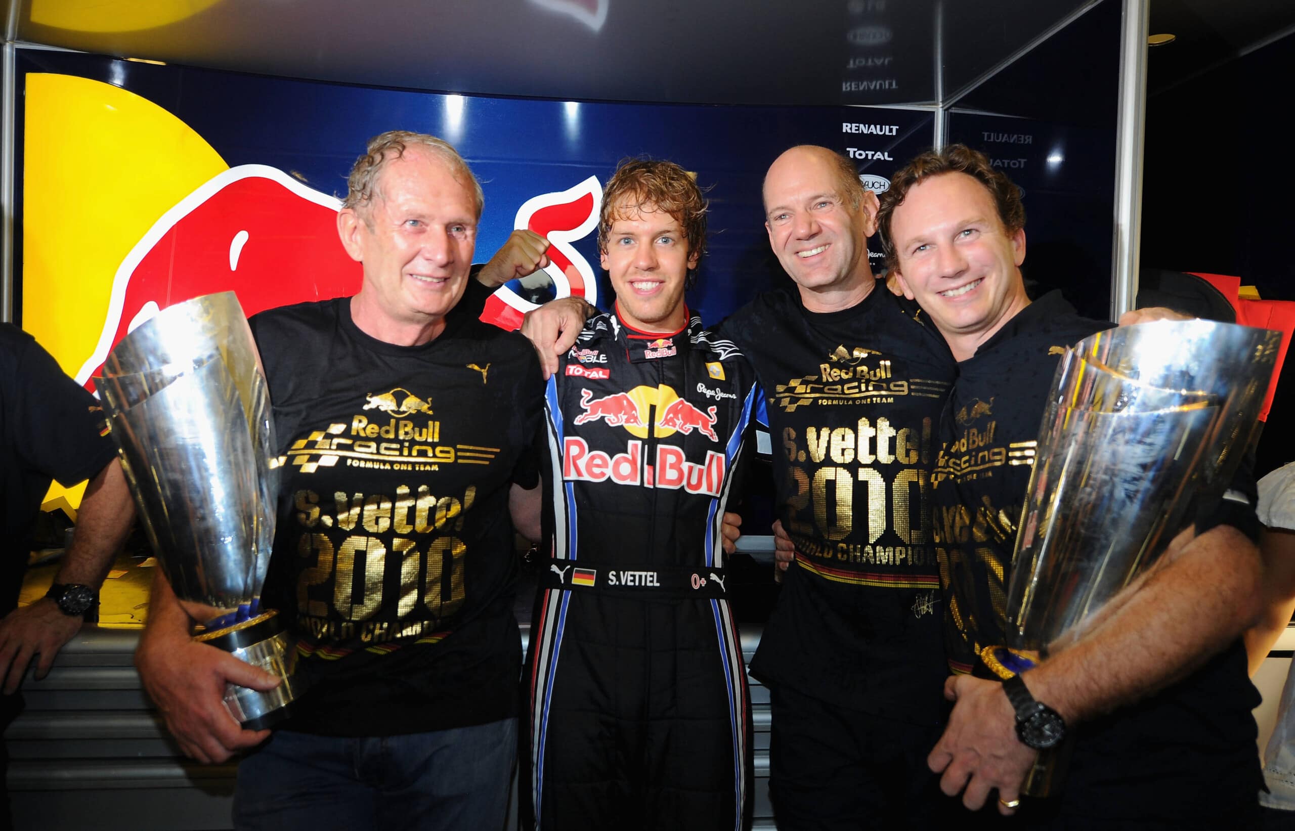 ABU DHABI, UNITED ARAB EMIRATES - NOVEMBER 14: Race winner and F1 2010 World Champion Sebastian Vettel (2nd left) of Germany and Red Bull Racing celebrates with Red Bull Racing Motorsport Consultant Dr Helmut Marko (left), Red Bull Racing Chief Technical Officer Adrian Newey (2nd right) and Red Bull Racing Team Principal Christian Horner (right) in their team garage following the Abu Dhabi Formula One Grand Prix at the Yas Marina Circuit on November 14, 2010 in Abu Dhabi, United Arab Emirates. (Photo by Clive Mason/Getty Images) *** Local Caption *** Sebastian Vettel; Christian Horner; Adrian Newey; Helmut Marko // Getty Images / Red Bull Content Pool // SI201412040507 // Usage for editorial use only //