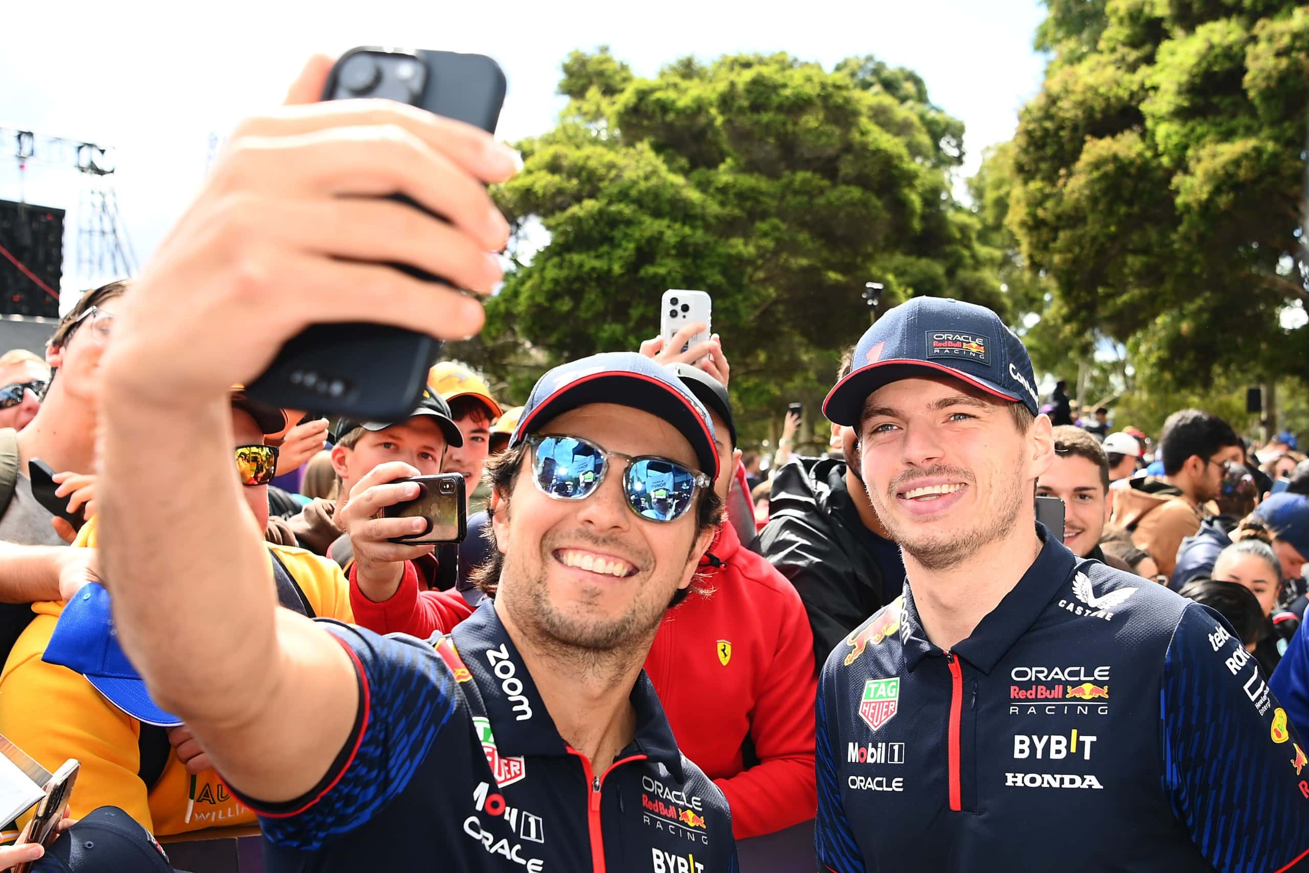MELBOURNE, AUSTRALIA - MARCH 30: Sergio Perez of Mexico and Oracle Red Bull Racing and Max Verstappen of the Netherlands and Oracle Red Bull Racing greet fans on the Melbourne Walk during previews ahead of the F1 Grand Prix of Australia at Albert Park Grand Prix Circuit on March 30, 2023 in Melbourne, Australia. (Photo by Quinn Rooney/Getty Images) // Getty Images / Red Bull Content Pool // SI202303300082 // Usage for editorial use only //