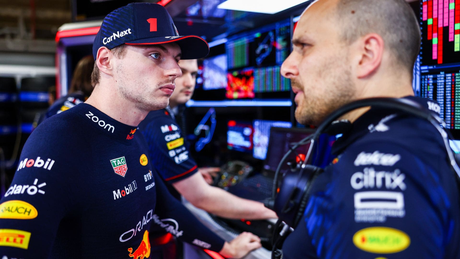 MIAMI, FLORIDA - MAY 06: Max Verstappen of the Netherlands and Oracle Red Bull Racing talks with race engineer Gianpiero Lambiase in the garage during qualifying ahead of the F1 Grand Prix of Miami at Miami International Autodrome on May 06, 2023 in Miami, Florida. (Photo by Mark Thompson/Getty Images) // Getty Images / Red Bull Content Pool // SI202305070021 // Usage for editorial use only //