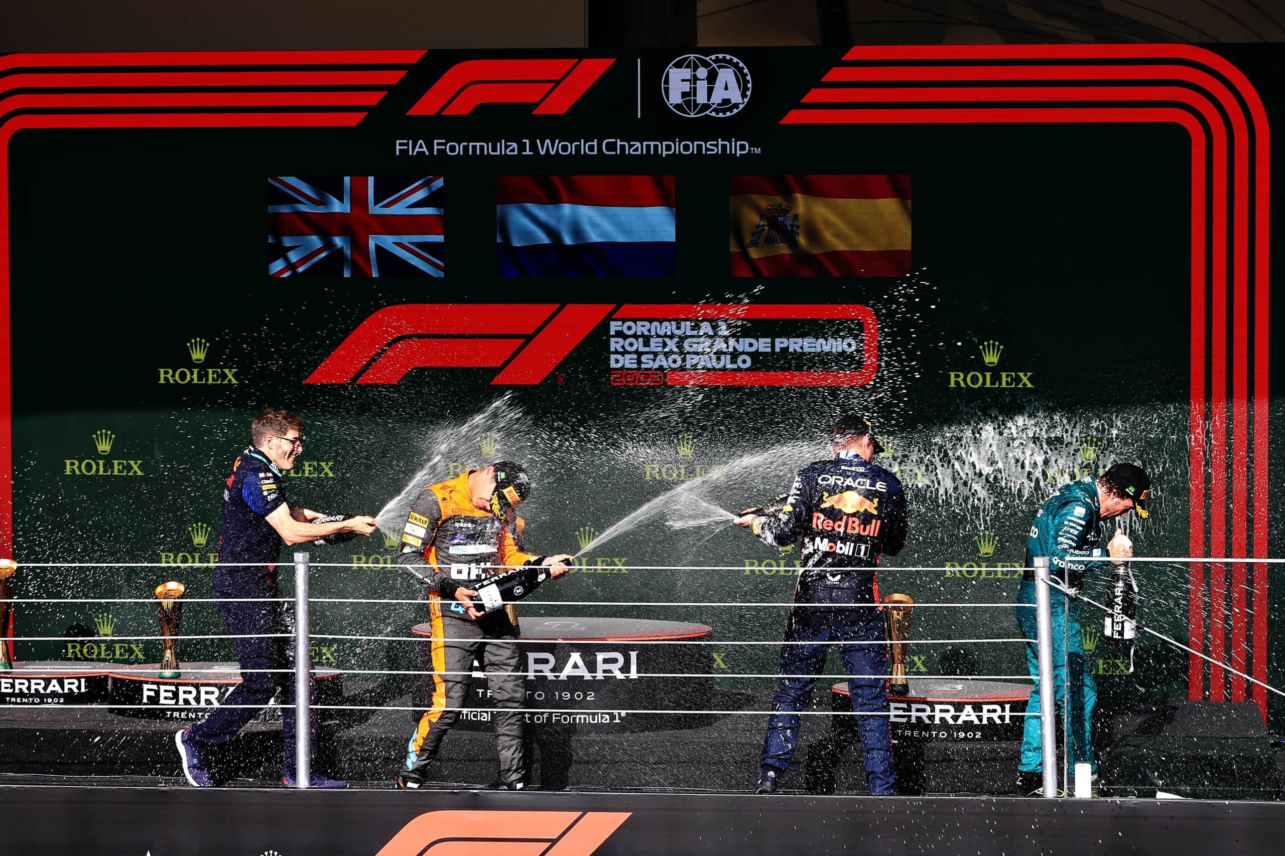SAO PAULO, BRAZIL - NOVEMBER 05: Second placed, Lando Norris of Great Britain and McLaren, Jeff Calam, Senior Projects Engineer at Red Bull Racing, Race winner, Max Verstappen of the Netherlands and Oracle Red Bull Racing and Third placed, Fernando Alonso of Spain and Aston Martin F1 Team celebrate on the podium during the F1 Grand Prix of Brazil at Autodromo Jose Carlos Pace on November 05, 2023 in Sao Paulo, Brazil. (Photo by Buda Mendes/Getty Images) // Getty Images / Red Bull Content Pool // SI202311050781 // Usage for editorial use only //