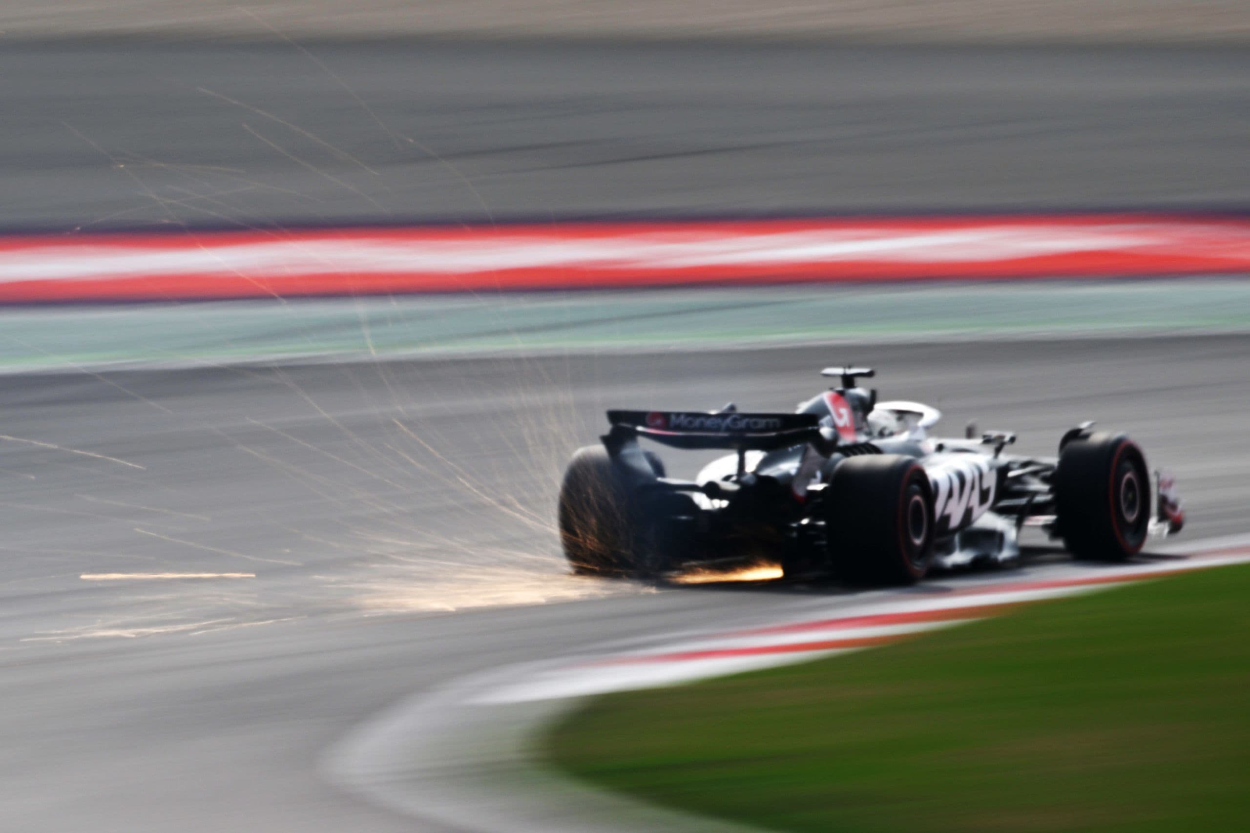 SHANGHAI INTERNATIONAL CIRCUIT, CHINA - APRIL 20: Sparks kick up from the rear of Kevin Magnussen, Haas VF-24 during the Chinese GP at Shanghai International Circuit on Saturday April 20, 2024 in Shanghai, China. (Photo by Mark Sutton / LAT Images)