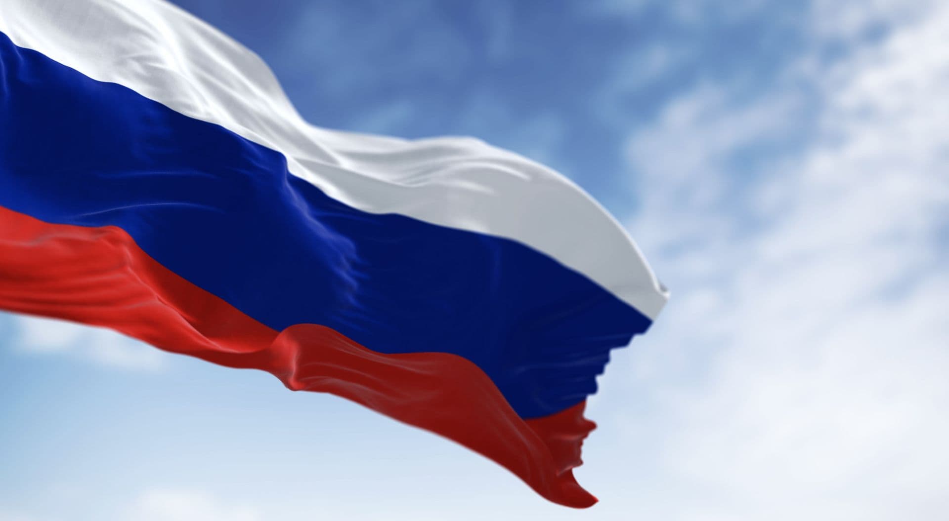 Three National Flags Of Russia Waving In The Wind On A Clear Day