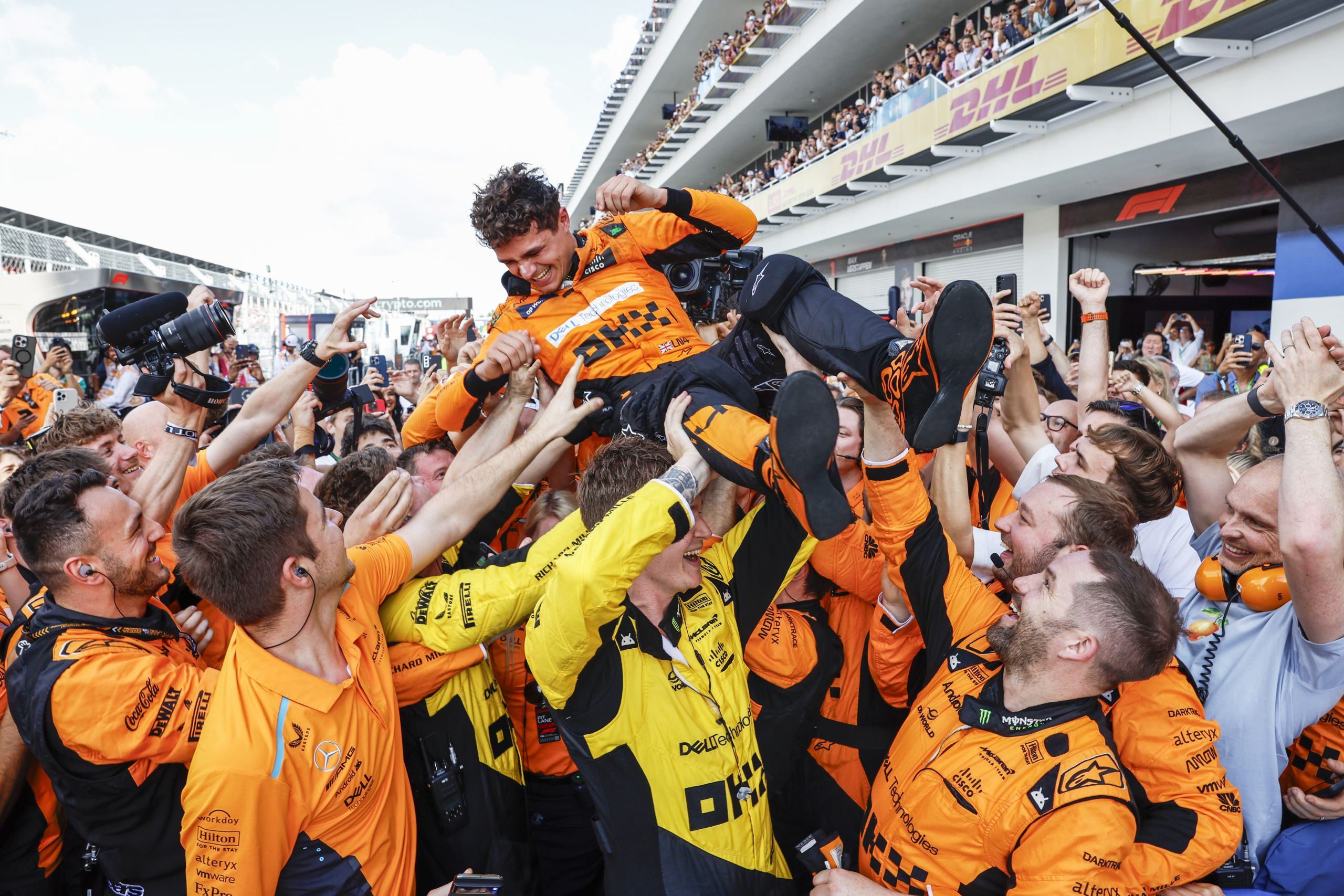 Lando Norris, McLaren F1 Team, 1st position, celebrates with his team on arrival in Parc Ferme