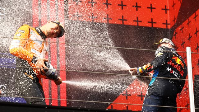 IMOLA, ITALY - MAY 19: Race winner Max Verstappen of the Netherlands and Oracle Red Bull Racing and Second placed Lando Norris of Great Britain and McLaren celebrate on the podium during the F1 Grand Prix of Emilia-Romagna at Autodromo Enzo e Dino Ferrari Circuit on May 19, 2024 in Imola, Italy. (Photo by Mark Thompson/Getty Images) // Getty Images / Red Bull Content Pool // SI202405190543 // Usage for editorial use only //