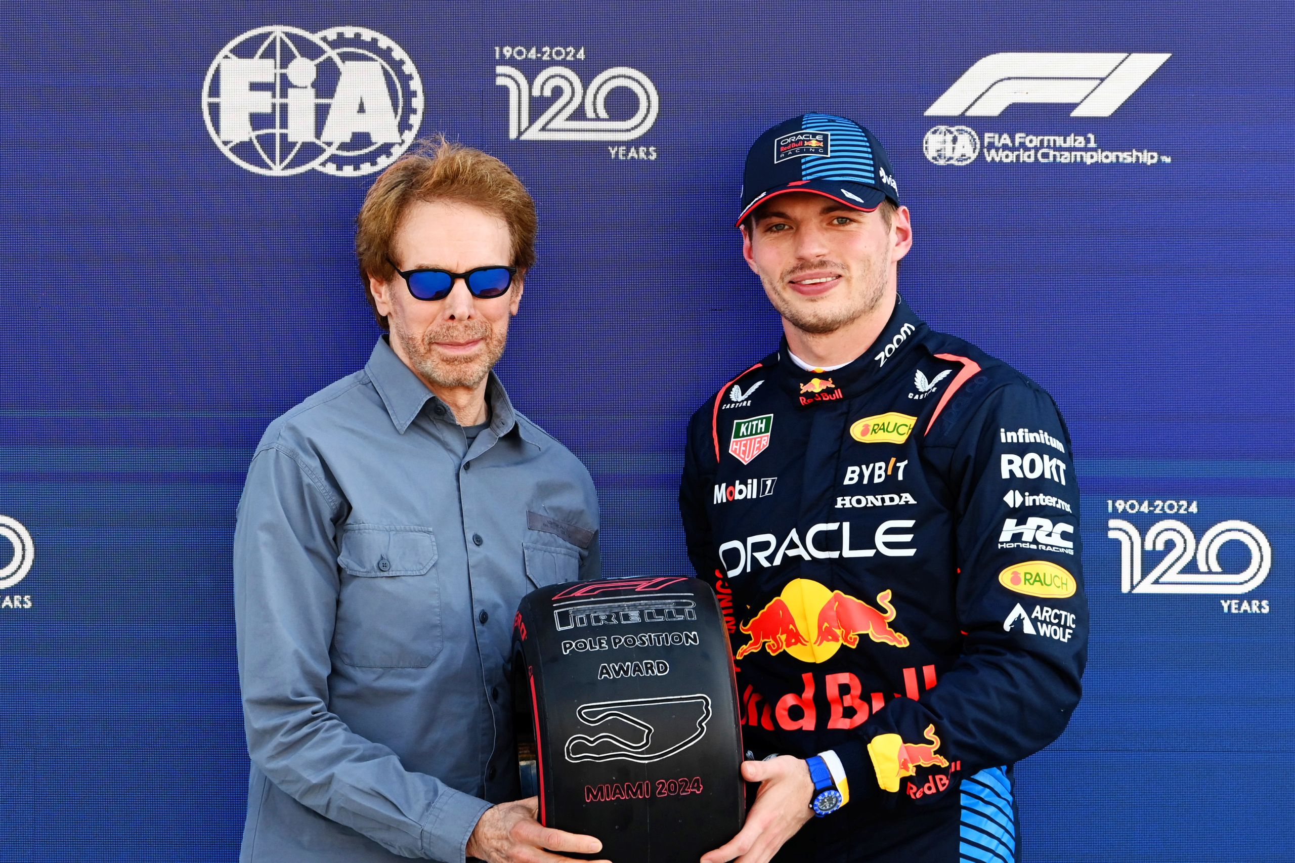 MIAMI INTERNATIONAL AUTODROME, UNITED STATES OF AMERICA - MAY 04: Pole man Max Verstappen, Red Bull Racing, receives his Pirelli Pole Position Award from Producer Jerry Bruckheimer during the Miami GP at Miami International Autodrome on Saturday May 04, 2024 in Miami, United States of America. (Photo by Mark Sutton / LAT Images)