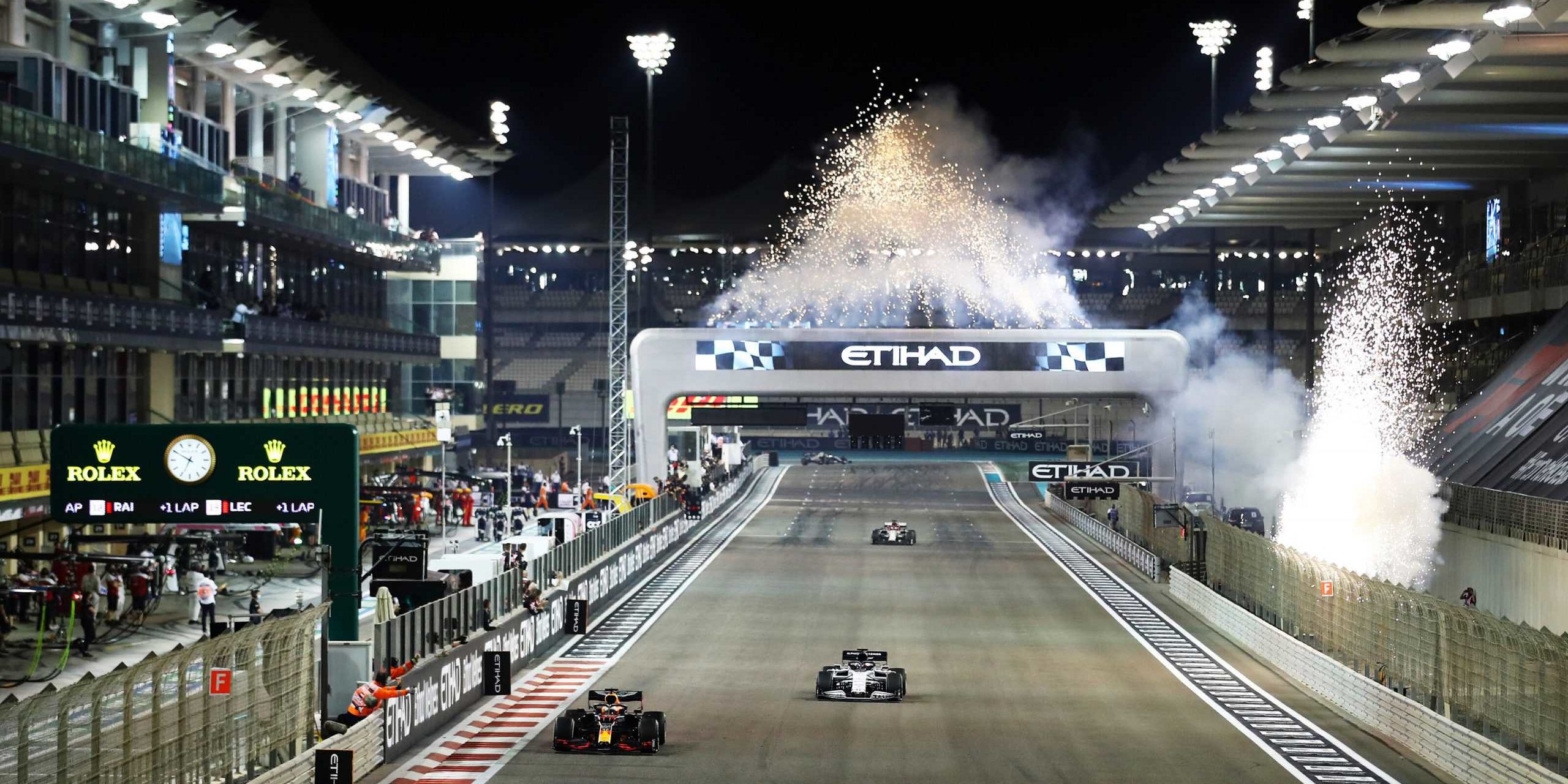 ABU DHABI, UNITED ARAB EMIRATES - DECEMBER 13: Fireworks go off as race winner Max Verstappen of the Netherlands driving the (33) Aston Martin Red Bull Racing RB16 crosses the line during the F1 Grand Prix of Abu Dhabi at Yas Marina Circuit on December 13, 2020 in Abu Dhabi, United Arab Emirates. (Photo by Bryn Lennon/Getty Images) // Getty Images / Red Bull Content Pool // SI202012130552 // Usage for editorial use only //