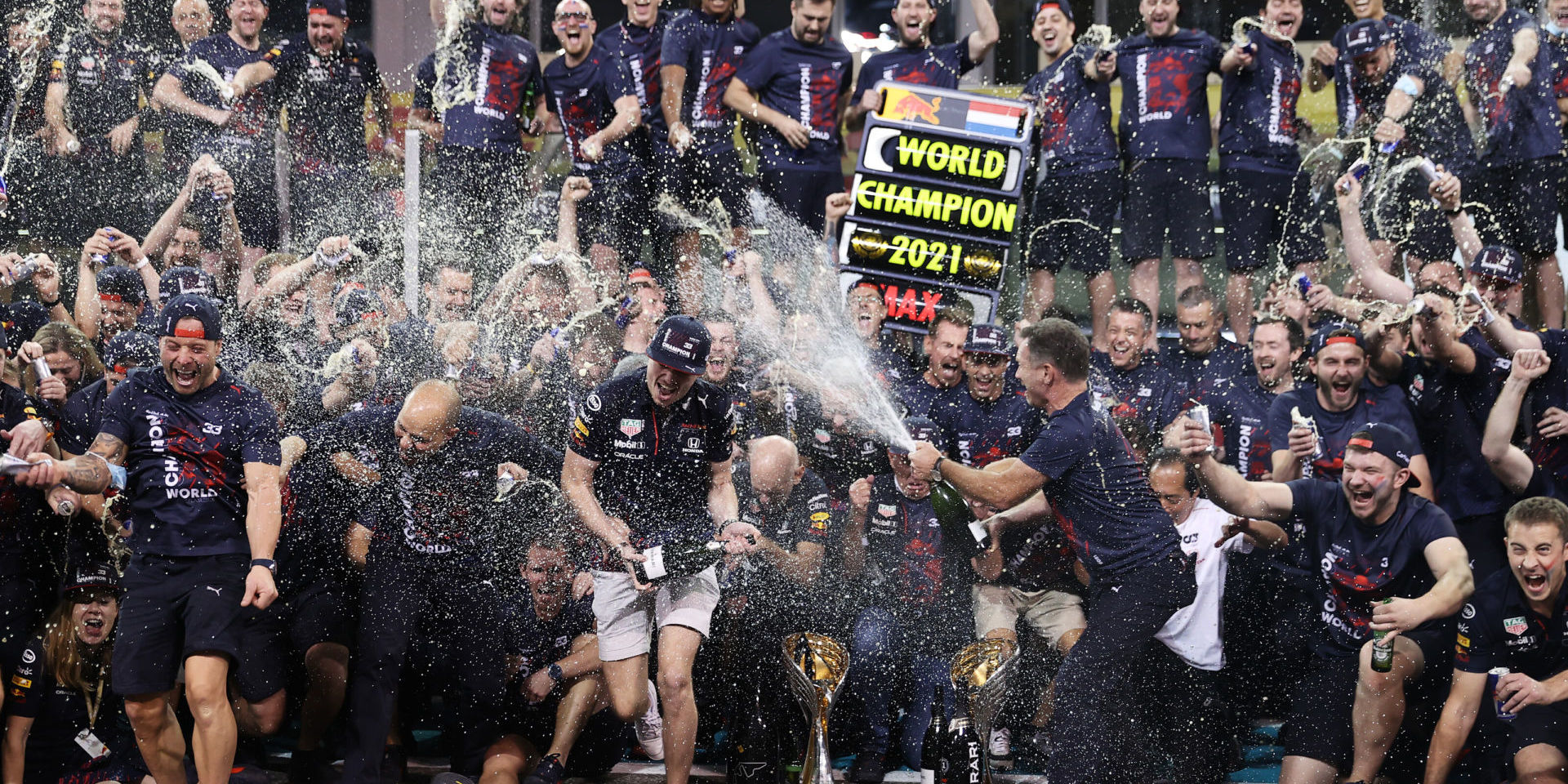 ABU DHABI, UNITED ARAB EMIRATES - DECEMBER 12: Race winner and 2021 F1 World Drivers Champion Max Verstappen of Netherlands and Red Bull Racing celebrates with his team after the F1 Grand Prix of Abu Dhabi at Yas Marina Circuit on December 12, 2021 in Abu Dhabi, United Arab Emirates. (Photo by Lars Baron/Getty Images) // Getty Images / Red Bull Content Pool // SI202112120622 // Usage for editorial use only //
